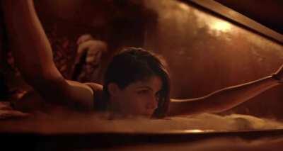 Alexandra Daddario tied to a bed for a rough BDSM session