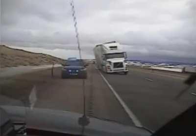 Wind Blown Semi Crushes Police Car