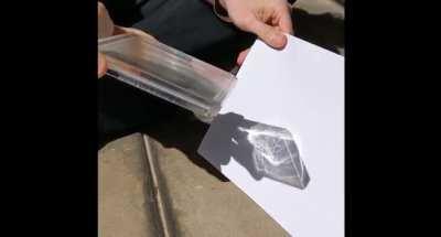 Hiding Images in Plain Sight: The Physics Of Magic Windows