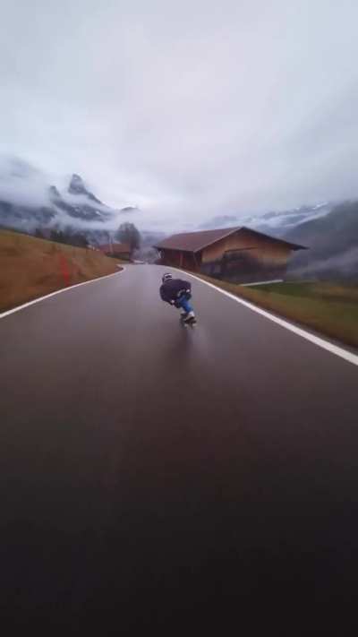 Diego Poncelet speeding downhill on wet road