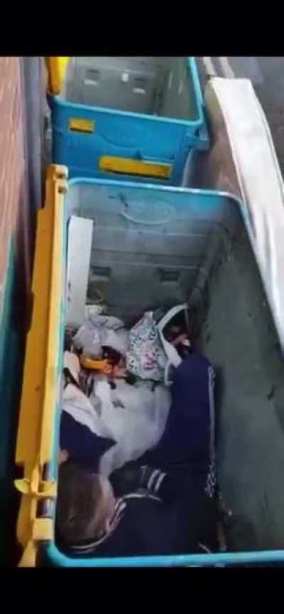 Some bloke lying in a bin talking to himself after doing pills &amp; powder