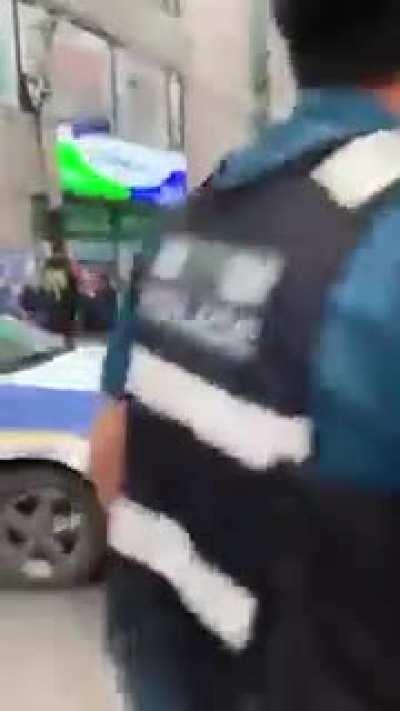 Korean lady drives into a convenience store. Can anyone translate what's going on at the end?