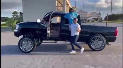 Walking next to a truck to film a video