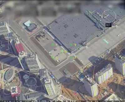 Russian drone footage of Kyiv mall being striked at night by a ballistic missile after a Ukranian MLRS was spotted entering the building.