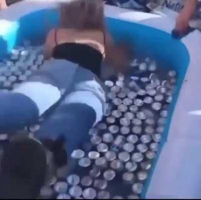 HMC as I jump into a kiddie pool completely full of beer cans