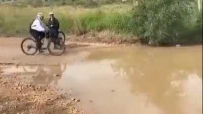 WCGW riding a bicycle into a puddle