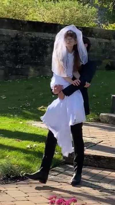 groom carries bride's special needs sister down the aisle so the sis could have her special moment too