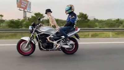 skeleton riding a motorcycle in public roads