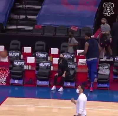 Embiid hits a no-look shot and walks off.