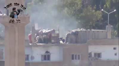 Pro-Assad militia launching rockets at Opposition positions from interesting improvised fighting position - Daraa al-Balad - 2013