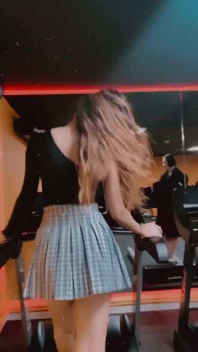 Walking on tread mill with miniskirt