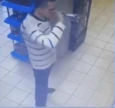 Russian man casually drinking an entire bottle of vodka to avoid paying for it