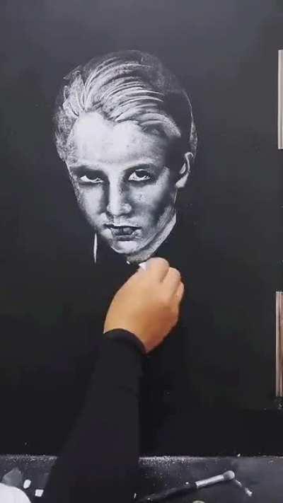 drawing malfoy with chalk on a blackboard
