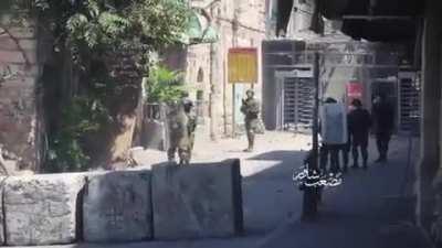 Palestinian youth throws rocks at IDF soldiers from point-blank range, soldiers don't attack back