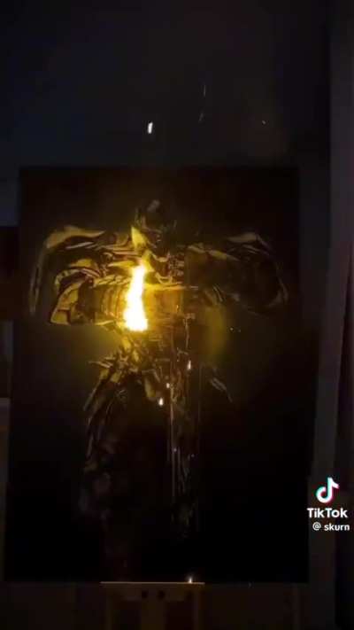 This artist putting the finishing touches on his amazing paintings