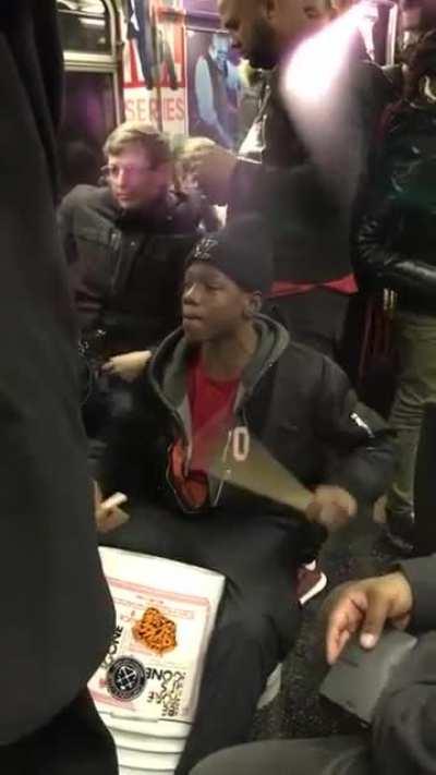 kid playing drums on nyc subway and kills it!
