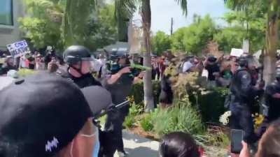 LAPD beats protesters who have their hands up