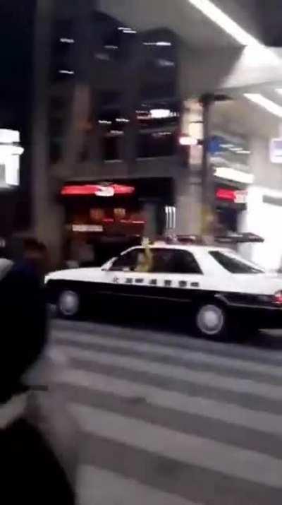 Man in Japan steals a police car and waves bye while driving off