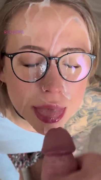 Beautiful babe with glasses gets her face painted