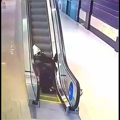 two girls and an escalator