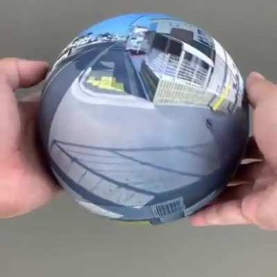 A 360° photo printed on a sphere.