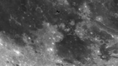 This is the International Space Station passing in front of the moon as seen from my backyard in Detroit. I show it in a slowed-down version then in real-time speed.