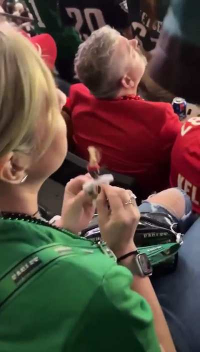 Lady caught doing witchcraft during the super bowl game