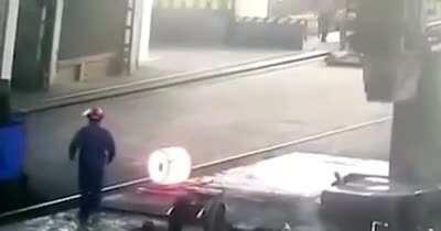 Man hit by hot iron ball