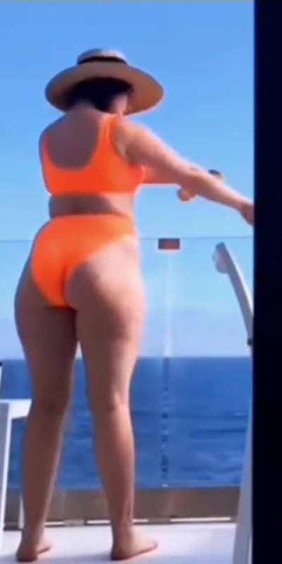 emma kenney with orange bikini and straw hat