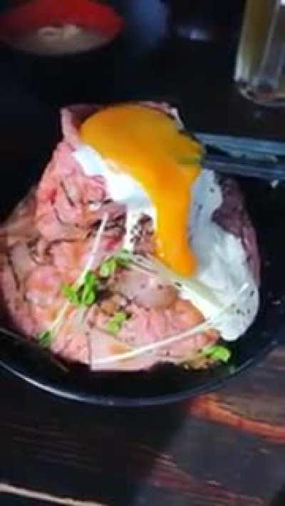 BeMesmerized. Gif. Please fuck me in the mouth with this. (A volcano oozing yolk over a kobe beef mound)