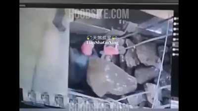 Someone trying to clear a rock crusher