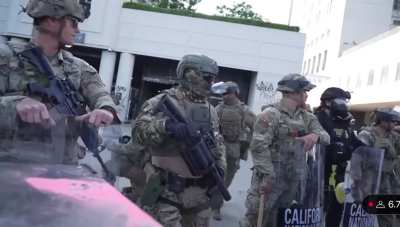 Guardsman tells protesters to be safe and throws peace sign before masking up and getting ready for battle after protest declared illegal.
