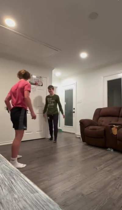 Kid puts hole in wall, well attempting a “basketball” dunk.
