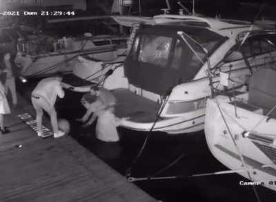 Guy steps on a ball fender