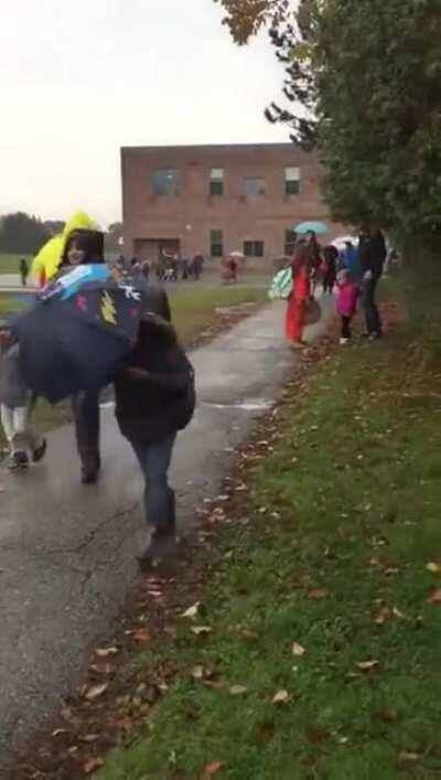 Dad picks up daughter from school in a chicken suit.