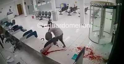 Security guard neutralizes Bank robber.