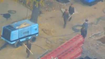 rare video smuggled from North Korea showing soldiers at work in a construction site 
