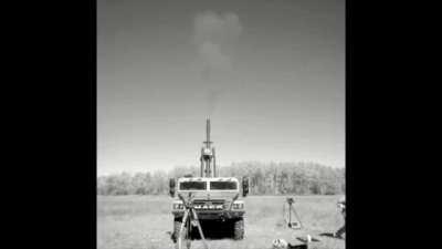 Mack Sherpa light utility vehicle mounting a 105mm howitzer operating on the 