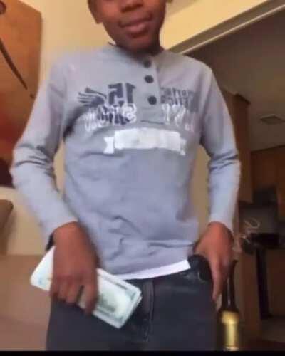 Player shows off his cash and gun