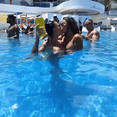 In the pool making friends and keeping the guys here hard as they watch the show