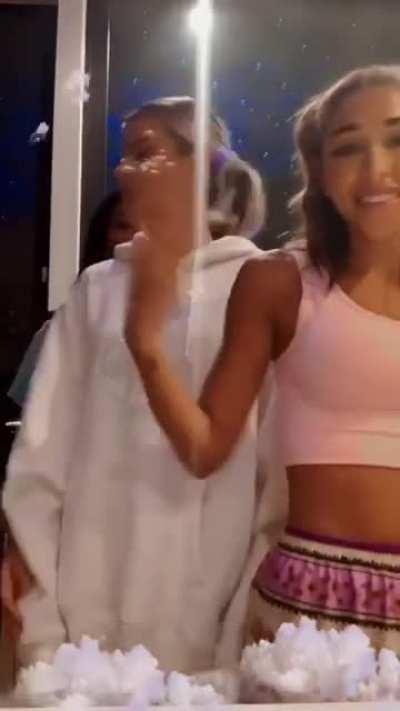 Cindy bending Alissa over