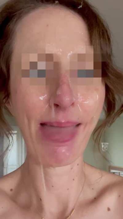 Sexy milf reveling in a massive facial!