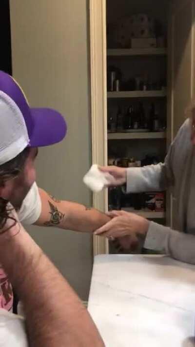 A mother seeing sons new tattoos