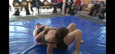 Strong and hot Woman humiliates Man with a reverse headscissor