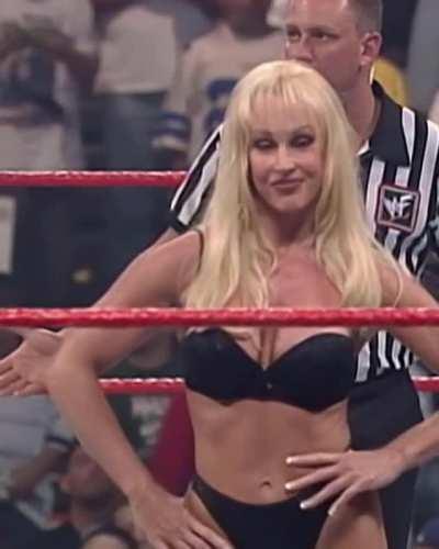 Debra taking off her own dress in ring