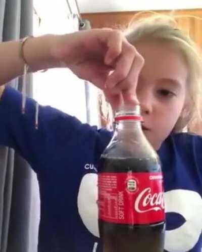 This kid desperate for cold drink.