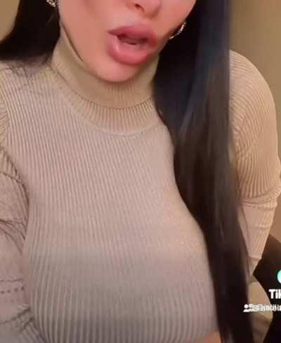 Tits so big they pop out the turtleneck