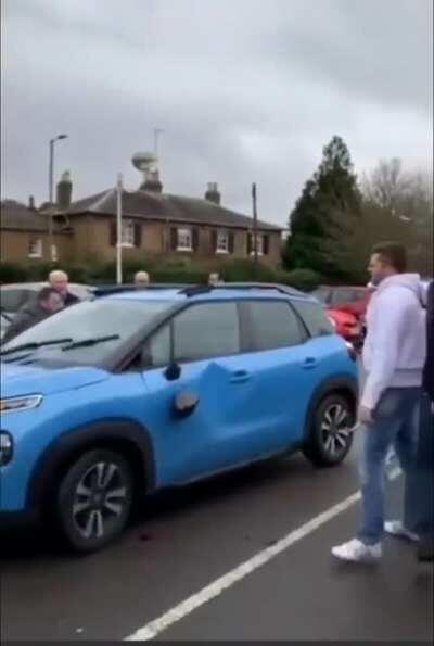Lady tries driving away after hitting Tesco employee