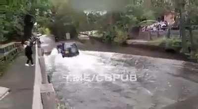 Going at high speed on a motorcycle through the flood water.