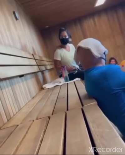 Woman gets hot in sauna, holds the door open and tells a dude questioning her to 'f*ck off and die' (not mine)